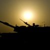 Iraqi tankers tank crewmen from 1st Company, 2nd Regiment, 34th Brigade, 9th Iraqi Army take a few moments to rest after a day of M1A1 live-fire training at the Besmaya Combat Training Center, Sept. 27. The live- fire was a culminating exercise of the Maneuver Collective Training Course where the tankers practice platoon movement techniques in their various platoons to increase crew competency.